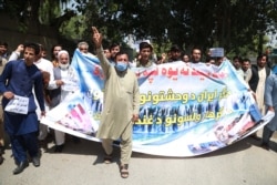 Afghans rally in Jalalabad on June 8 to demand justice for the migrants allegedly killed by Iranian security forces.