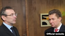 EU Energy Commissioner Andris Piebalgs (left) with Gazprom's Aleksei Miller in Brussels on January 8