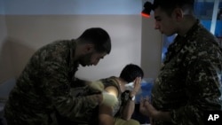 A wounded Armenian soldier receives treatment in a military hospital near the front line in the separatist region of Nagorno-Karabakh.