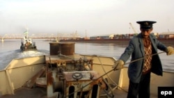 A barge operator on the Amu Darya river near the Uzbek border town of Termez