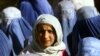 A young Afghan woman shows her face in public for the first time after five years of Taliban rule in November 2001. Does the Koran really call for such standards of decency for women?