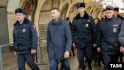 Russian opposition leader and anticorruption blogger Aleksei Navalny is detained by police in a Moscow subway station on February 15.