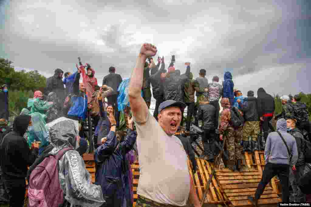 People take part in a protest against the Bashkir Soda Company&#39;s plans to use the area for limestone mining on August 16. Local residents started staging rallies on August 15 and drawing up online petitions to protect and preserve Kushtau as one of the four &quot;shihans,&quot; the remains of ancient sea reefs, stretching along the Belaya River over 20 kilometers, holding paleontological value and inhabited by endangered species.