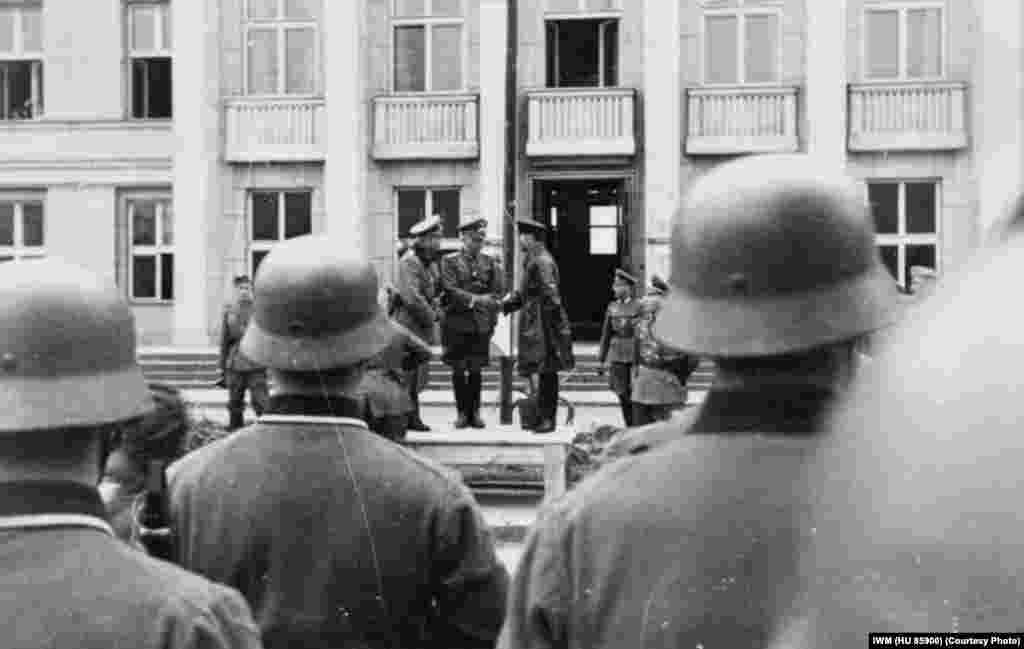 German Lieutenant Colonel Gustav-Adolf Riebel shakes hands with Brigadier Semyon Krivoshein during the joint Nazi-Soviet victory parade in Brest.