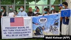 Afghan former interpreters for U.S. and NATO forces gather during a demonstration in downtown Kabul on April 30.