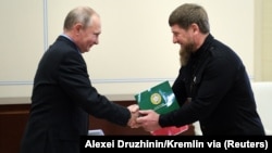 Russian President Vladimir Putin (left) meets with Chechen strongman Ramzan Kadyrov near Moscow in June 2018.