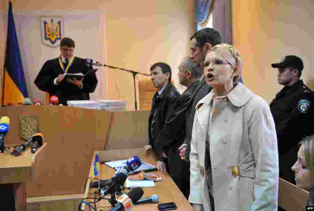 Yulia Tymoshenko (right) addresses the court as Judge Rodion Kireyev reads the verdict against her in Kyiv in October 2011.