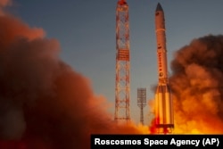 A Proton-M booster rocket blasts off from the launch pad at Baikonur in July 2021.