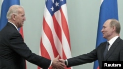 Prime Minister Vladimir Putin (right) meets with U.S. Vice President Joe Biden in Moscow.