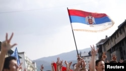 People protest in support of wartime General Ratko Mladic in the Bosnian Serb town of Pale, near the Bosnian capital of Sarajevo, on May 27.