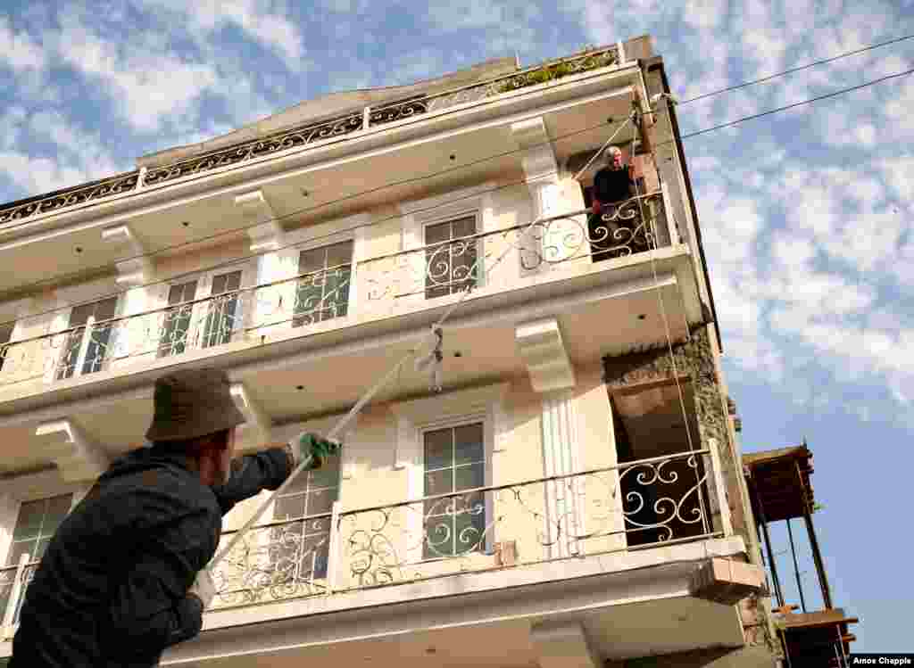 Laborers restore a building due to open as a hotel next year. Current laws in the territory forbid foreign citizens from buying property, but the Abkhaz government might open its markets.