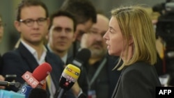 EU foreign policy chief Federica Mogherini (right) talks to journalists prior to the Informal Meeting of EU Foreign Ministers in Riga on March 6.