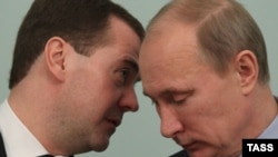 Prime Minister Vladimir Putin (left) and President Dmitry Medvedev