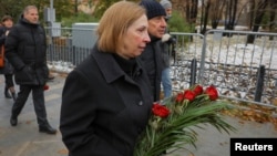 The U.S. ambassador to Russia, Lynne Tracy, lays flowers at the Solovetsky Stone to remember the victims of political repression, in Moscow on October 29.
