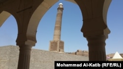 Mosul's Great Nur al-Din Mosque with its famous leaning minaret is still standing even though there are fears that Islamic State may yet destroy it. 