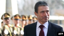 NATO Secretary-General Anders Fogh Rasmussen reviews an honor guard during a welcoming ceremony at the Presidential Palace in Kabul in December.