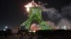 Iranians watch fireworks around the Azadi (Freedom) Tower during a ceremony marking the 45th anniversary of the Islamic Revolution in Tehran on February 10.