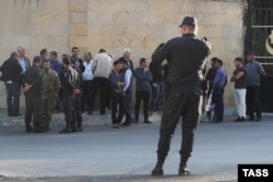 The relatives of wounded or missing soldiers wait outside an army hospital in Baku last month.