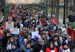 Opposition protesters hold copies of the Russian Constitution during a rally against Putin's reforms in Moscow on January 19.