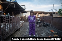 Sabrina, 7, on her family's farm in Pavlopil