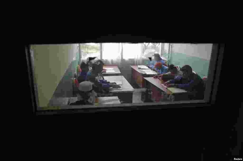 Blind students attend a lesson at the school.