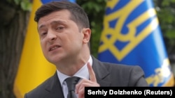 Ukrainian President Volodymyr Zelenskiy speaks at an open-air news conference in Kyiv on May 20.