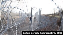 Hungarian personnel patrol at the border station at Roszke.