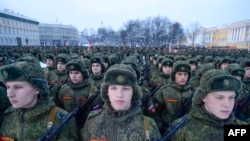 Russian servicemen march during a military parade marking the 75th anniversary of the lifting of the Siege of Leningrad in St. Petersburg on January 27.