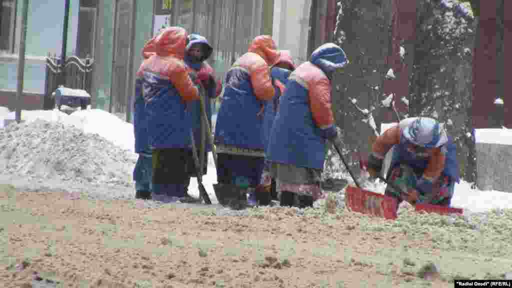 A cleanup crew works to clear the heavy snow in Dushanbe, Tajikistan.