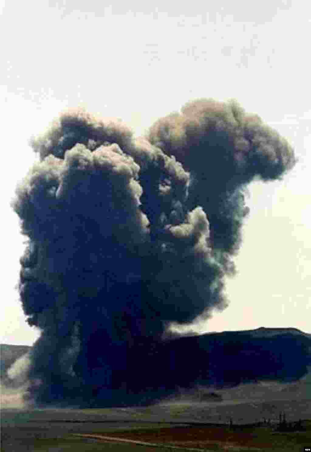 A giant cloud of black smoke arises as Kazakhstan&#39;s last nuclear weapons test site is put out of action with a bang in July 2000. The former Soviet republic blew up the sole remaining test tunnel at Semipalatinsk with 90 tons of explosives.