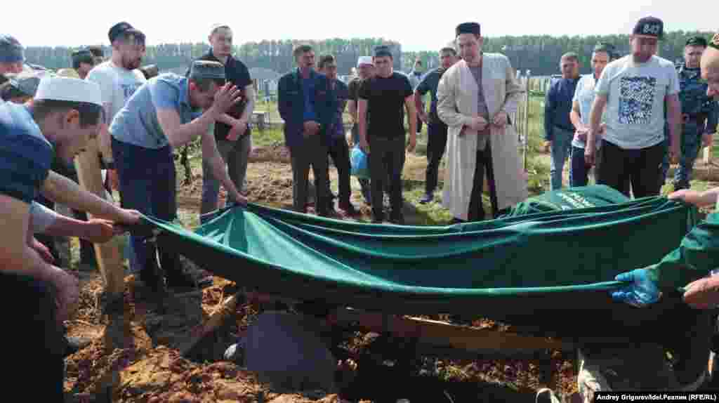 A funeral is held at the Muslim cemetery in Kazan for students killed in the shooting on May 12.