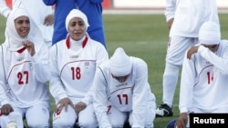 Players for Iran's women's national soccer team react after the disqualification announcement in Amman, Jordan, on June 3.