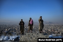 Members of the Taliban overlook the city of Kabul on January 10.