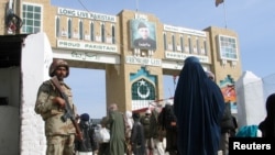 A Pakistani soldier keeps guard at the Friendship Gate, which marks the Afghan border crossing at the Pakistani town of Chaman.