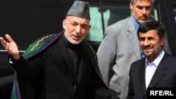 Afghan President Hamid Karzai (left) welcomes his Iranian counterpart Mahmud Ahmadinejad to Kabul.