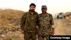 Colonel Fashad Hasounizadeh (right) was killed in southern Syria, one of three senior commanders to die there recently.