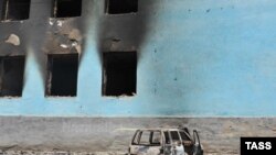 A burned-out house following ethnic clashes in Osh