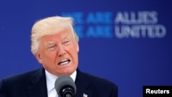 U.S. President Donald Trump speaks at the start of the NATO summit at the alliance's new headquarters in Brussels on May 25.