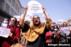 Afghan women's rights defenders and civil activists protest to call on the Taliban to preserve their achievements in front of the presidential palace in Kabul on September 3, 2021.