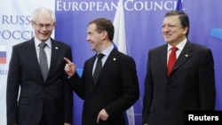 Russian President Dmitry Medvedev (center) is welcomed by European Council President Herman Van Rompuy and EU Commission President Jose Manuel Barosso in Brussels on December 15.