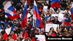 People attend a concert marking the seventh anniversary of Russia's annexation of Crimea at Luzhniki Stadium in Moscow on March 18.