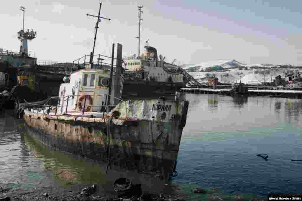 Russian fishing boats on Shikotan, one of the smaller disputed islands. With the prospect of the United States establishing a military outpost on the Kuriles if returned to Japan, Russia is unlikely ever to agree to a handover of all the disputed islands. But one possibility could end the dispute in what Russian President Vladimir Putin has called a &quot;hikiwake&quot; (the term for &quot;draw&quot; in judo).