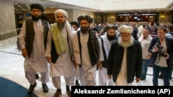 Mullah Abdul Ghani Baradar (third from left), the Taliban's top political leader, arrives with other members of a Taliban delegation for talks in Moscow on May 28, 2019. 