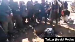 A grab from the video footage showing the stoning, which is alleged to have taken place in Afghanistan. 