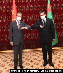 Chinese Foreign Minister Wang Yi with his Turkmen counterpart, Rashid Meredov, in Ashgabat on July 12.