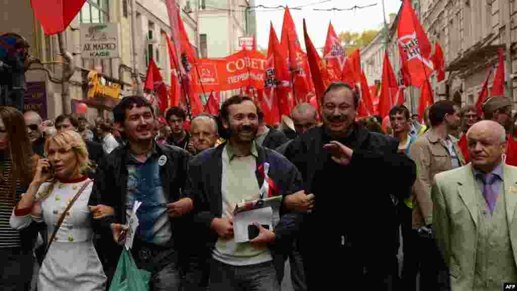 Gennady Gudkov (second from right), a deputy head of the Just Russia party and Putin critic who was expelled from the Duma on September 14, gestures as he takes part in the protest.