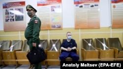 A Russian recruit waits for a medical check-up during spring conscription at a recruitment center in St. Petersburg.