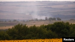 PHOTO GALLERY: The Aftermath Of The Downing Of Malaysia Airlines Flight MH17