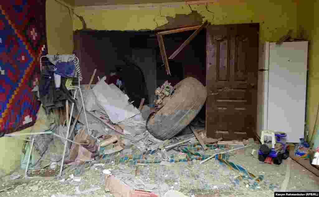 A section of the plane&#39;s landing gear inside a house.&nbsp;