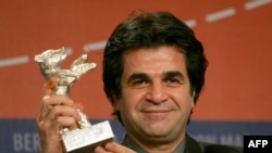 Jafar Panahi poses with his "Jury Grand Prix" silver bear for his movie "Offside" at the 56th Berlinale Film Festival in Berlin in 2006. Panahi is now banned from making films in Iran.